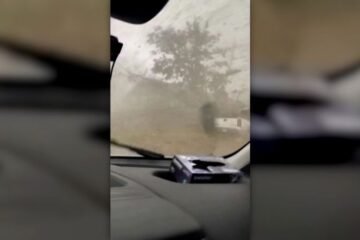 Man rides out tornado inside van. See the footage