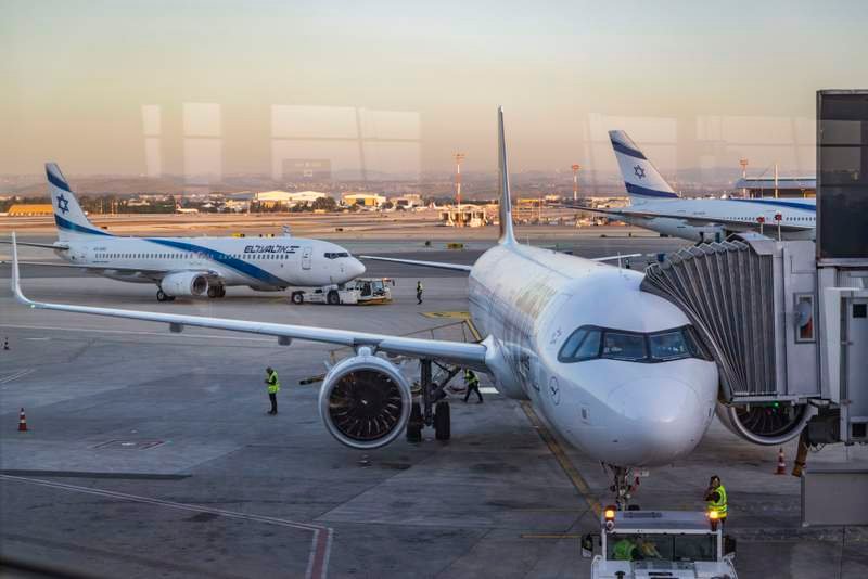 Herzog welcomes Israelis home from wartime rescue flights at Ben-Gurion airport