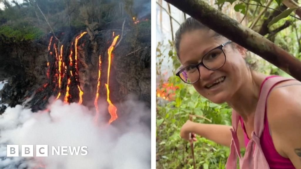 Woman is steps away from lava as volcano erupts on Reunion Island