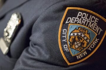 NYPD says officer who guards mayor’s home is suspended after shooting a man while off duty