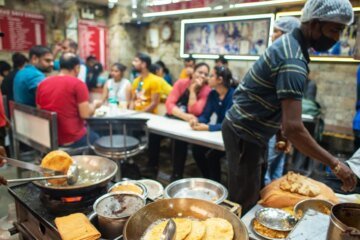 Indians line up for these flatbreads. But now gas is running short.