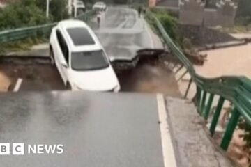 Car swept away after bridge collapse