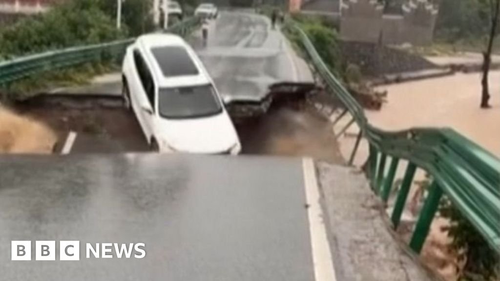 Car swept away after bridge collapse