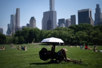 Eastern US sweats through another hot day before rain, cold move in