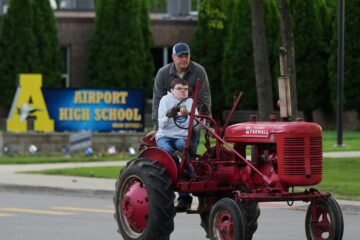 Michigan seniors arrive at school in style on Tractor Day