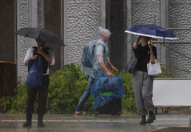 Tropical storm Jangmi batters Japan, cuts power to 60,000 homes